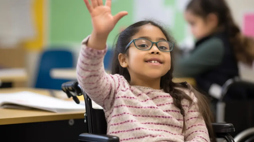 Girl in a wheelchair raising her hand in a classroom setting